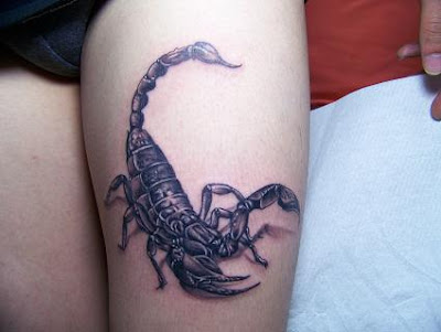 scorpion tattoo on a girl's leg