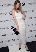 Jaime King in feather skirt over a silk white top paired at the Who What Wear x Target Launch Party red carpet dress