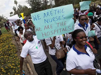 Nurses holding banners in a protest in Nairobi, Kenya June 12, 2017. REUTERS