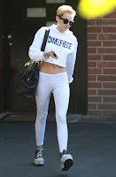 Miley Cyrus leaving recording studio in white outfit