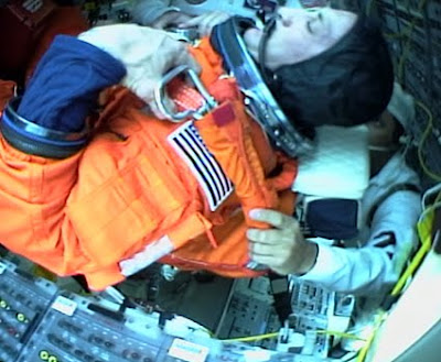 Commander Charles O. Hobaugh is secured into his seat aboard Atlantis