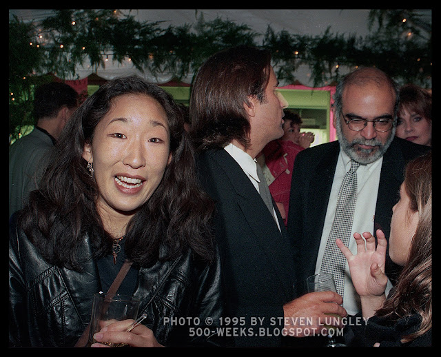 Sandra Oh laughing near Andy Garcia, TIFF, 1995 frame 03. Photo © 1995 Steven_Lungley