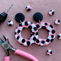 Flowers at the Door pink, white and black retro 50s style circle earrings, with large black circular stud and big pink, white and black polka dot hoops dangling.