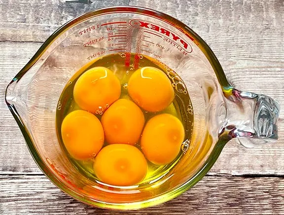 Eggs in a glass jug.