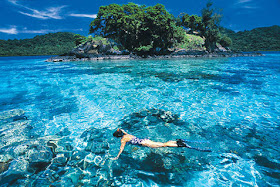 Fiji Island a girl swimming in water 