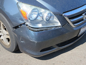 Cracked bumper and dented fender before repair at Almost Everything Auto Body