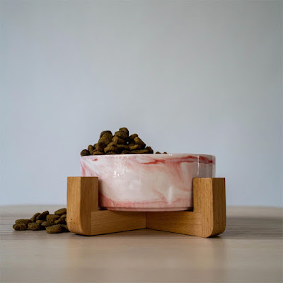 Mid-century modern dog bowl in pink swirl with wood stand