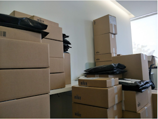 Boxes stacked high in an office