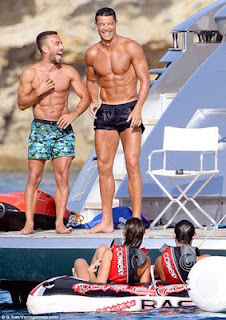 Cristiano Ronaldo Shows Off His Muscled Physique As He Enjoys Yacht Trip With Mystery Lady 