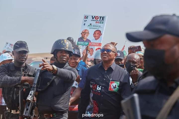 Peter obi and security men in uniform guarding him