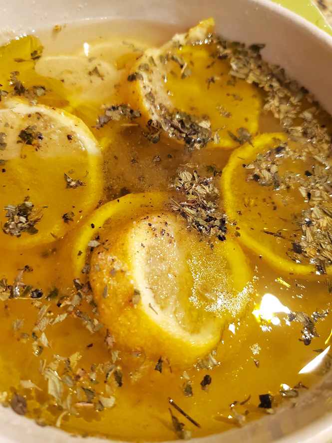 lemon juice with zest and herbs and butter