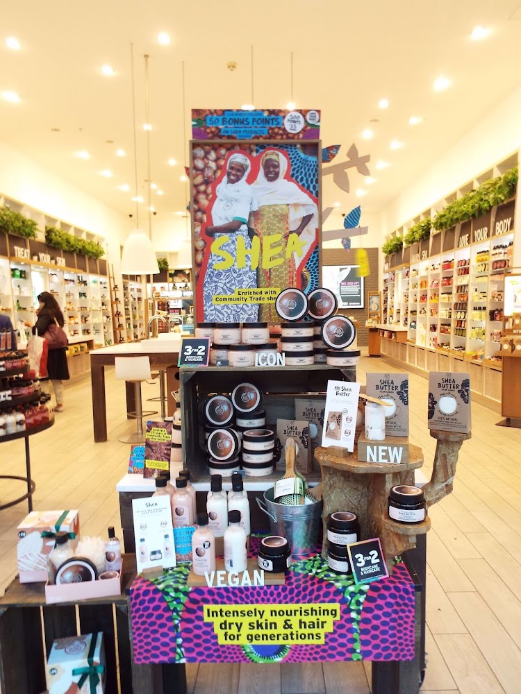 A display of The Body Shop ethical Shea Butter range at the entrance to The Body Shop Liverpool. Showing the ladies from the community fair trade who produce the shea butter and the range's vegan options.