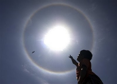 the boy and the sun and the sundog-ap photo