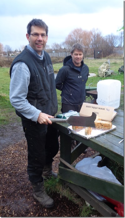 Ken cutting his cake with a billhook. Photo: Paul Loughnane