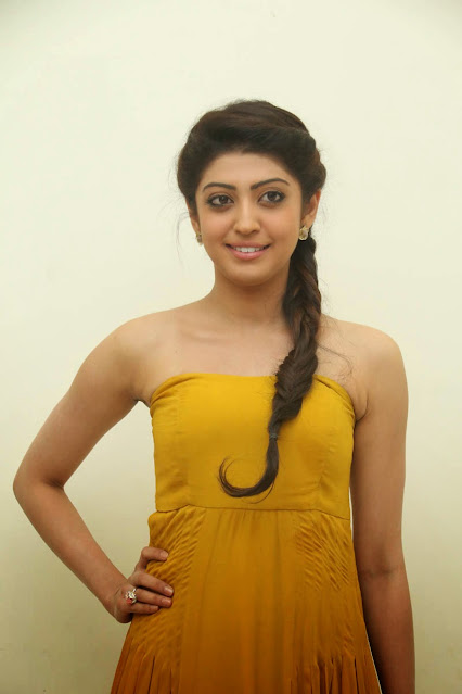 Pranitha Subhash looking adorable in a yellow sleeveless dress.