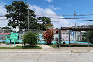 Large chair at bus stop in Brasil de Santa Ana, Costa Rica