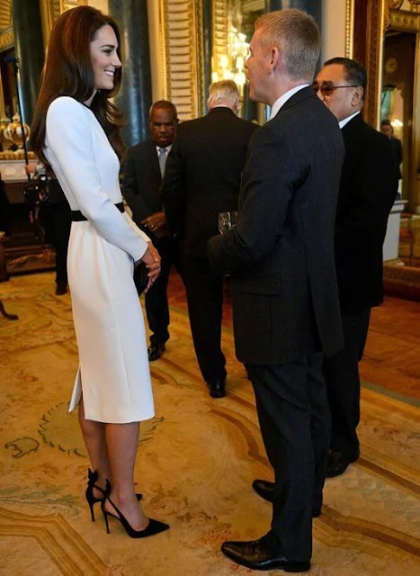 The Princess wore a white dress by Jenny Packham, Aquazzura slingback pumps, The Duchess wore a grecian dress by Suzannah