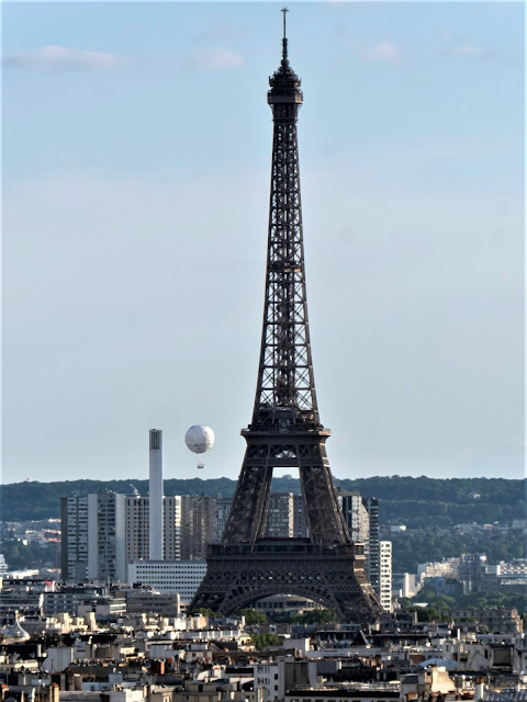 aerial view of Eiffel Tower with Ballon de Paris Generali in background