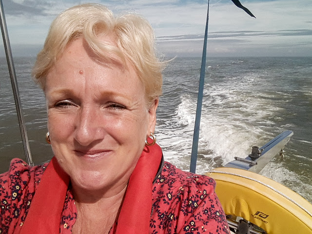 Photo of me enjoying the sunshine on Ravensdale's aft deck in the Solway Firth