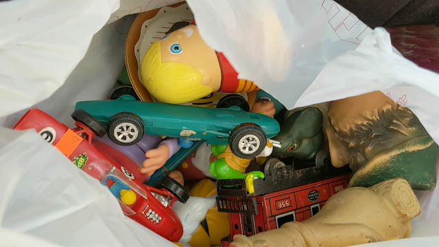 picture of a bag filled with vintage toys