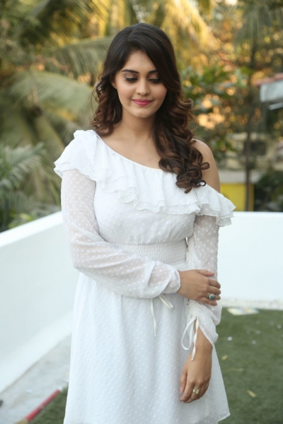 Surbhi Hot Image  In White Dress Fro Okka Kshanam Movie Success Meet