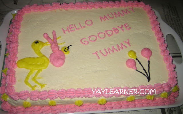 Pink cake for baby girl shower pink balloons