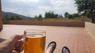 A chillaxing with a beer on the balcony