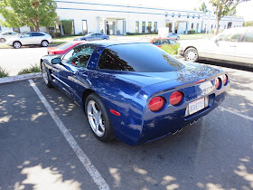 Dents & scrapes on Corvette bumper and quarter panel before repairs at Almost Everything Auto Body.