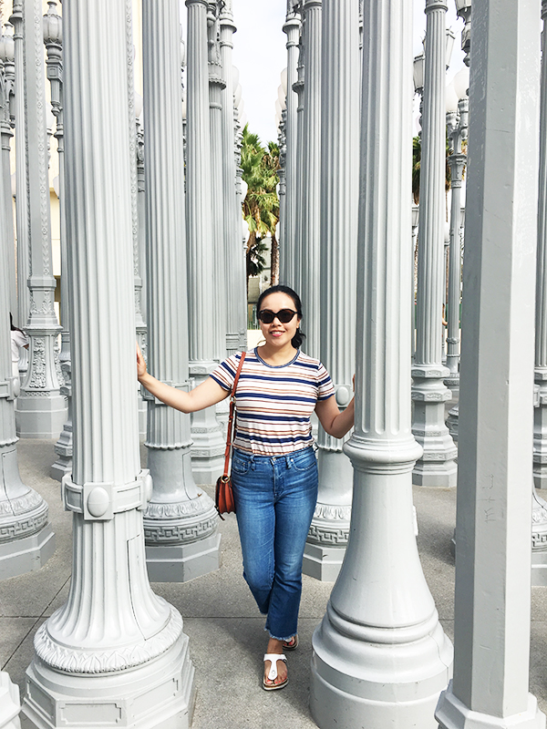 Vancouver beauty and lifestyle blogger Solo Lisa poses with the Urban Light art installation at LACMA.