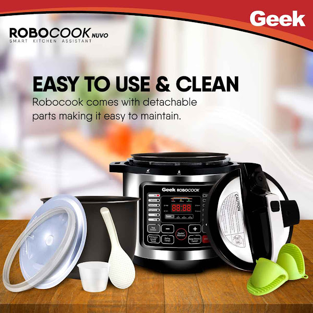 Geek Robocook  electric pressure cooker price with potholders, gasket, non stick, measuring cup and placed in a wooden table