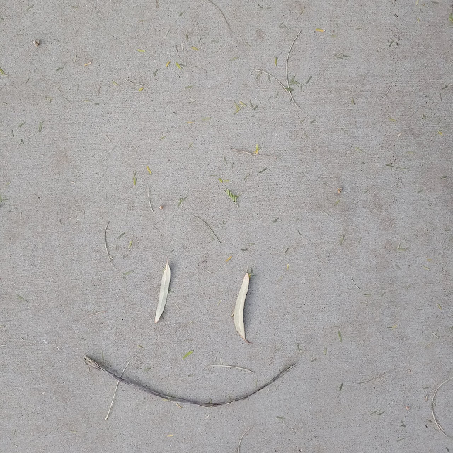 smiley on a sidewalk