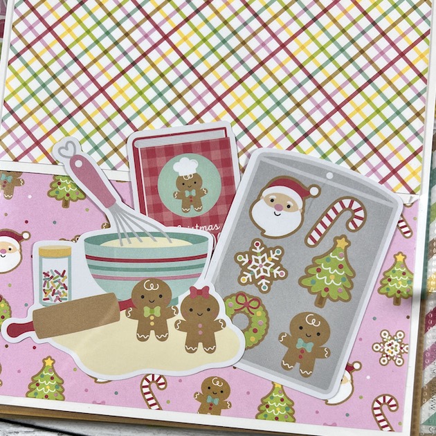 Christmas scrapbook album page with gingerbread cookies, a recipe book, and baking utensils