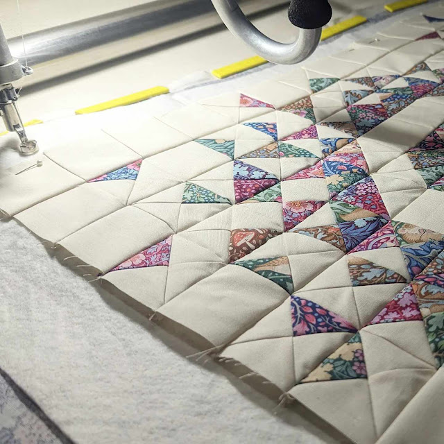 Longarm quilting a MINI Exploding Heart quilt made with Tilda fabrics