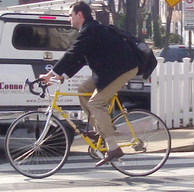 khakis navy blue blazer yellow bike