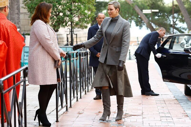 Prince Albert, Princess Charlene, Prince Jacques and Princess Gabriella. Charlene wore a grey jacket, sweater and skirt by Akris