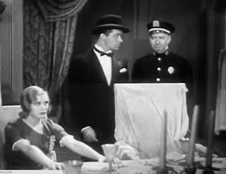 Ginger Rogers plays a dead body sitting motionless at a table