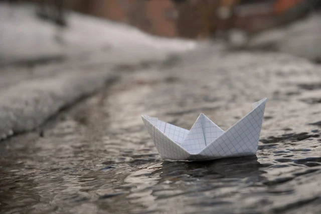 The Boy in the Paper Boat