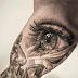 Beautiful Women Eye Design Tattoos on Arm