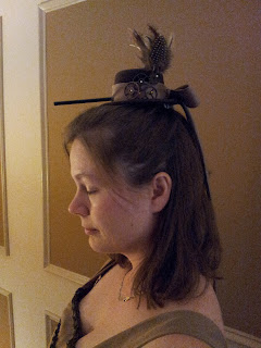 A side view of me wearing the hat. The straw is attached and sticking out the front.