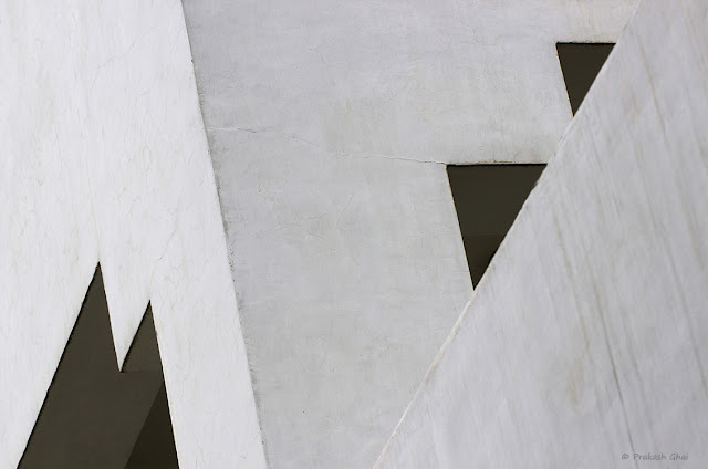 Two Triangles Vs Lines. A multi layer shot of two portions of a building shot via Canon 100mm Prime F2.8 Macro L Series Lens mounted on a Canon 600D Crop Sensor Camera.