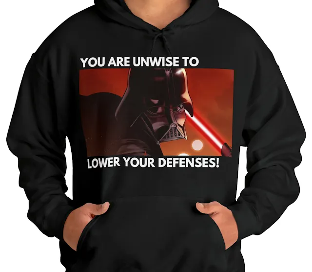 A Hoodie With Star Wars Darth Vader Looking Sideways and Caption You are Unwise to Lower Your Defenses
