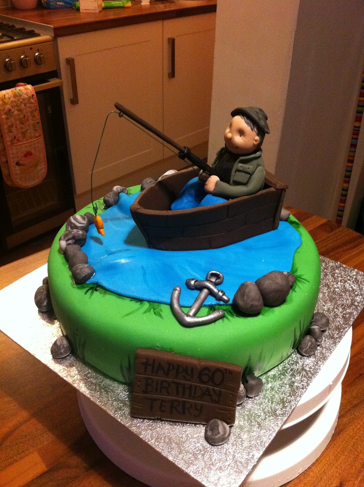 caked in icing: fishing theme cake