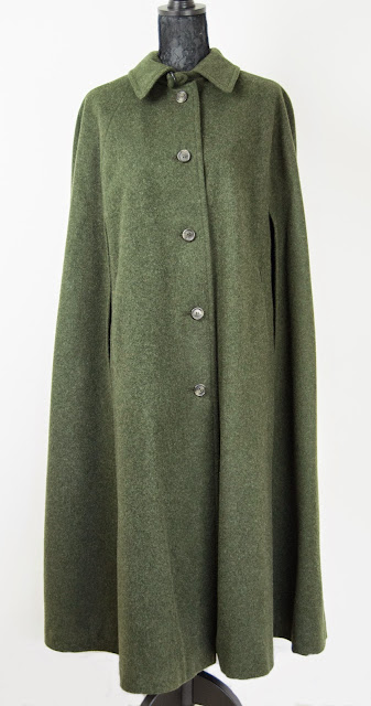 H Moser bottle green cape in the style of Victoria Beckham and Olivia Palermo