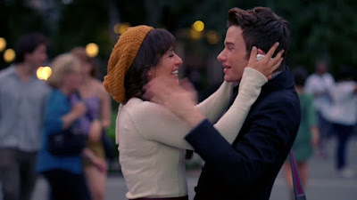Rachel and Kurt smiling at each other as they go to hug again