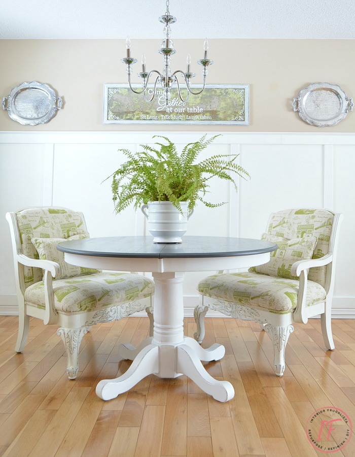 Old secondhand armchairs after DIY modern makeover paired with a dining table as formal host chairs.