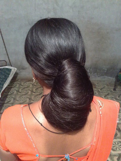 oiled long hair bun