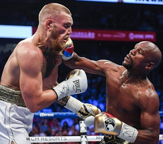 Still the king! Mayweather knocks out Conor McGregor in the 10th round -insists $600m 'fight of the century' will be his last (photos of celebs who attended)