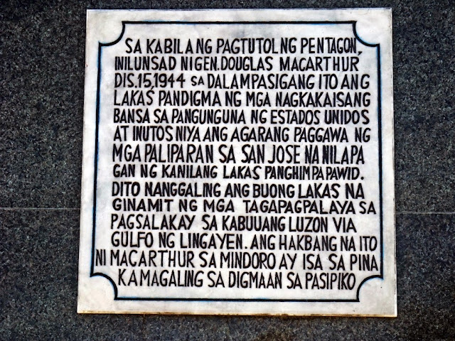 hostorical marker of MacArthur's war activities in Mindoro all written in Pilipino Language on the war memorial obelisk in San Jose Occidental Mindoro