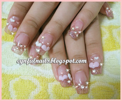 Pink glittery acrylic extension with baby pink and white puffy hearts and 