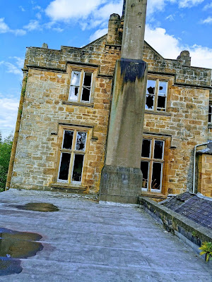 Exterior of mansion taken from the back of the house